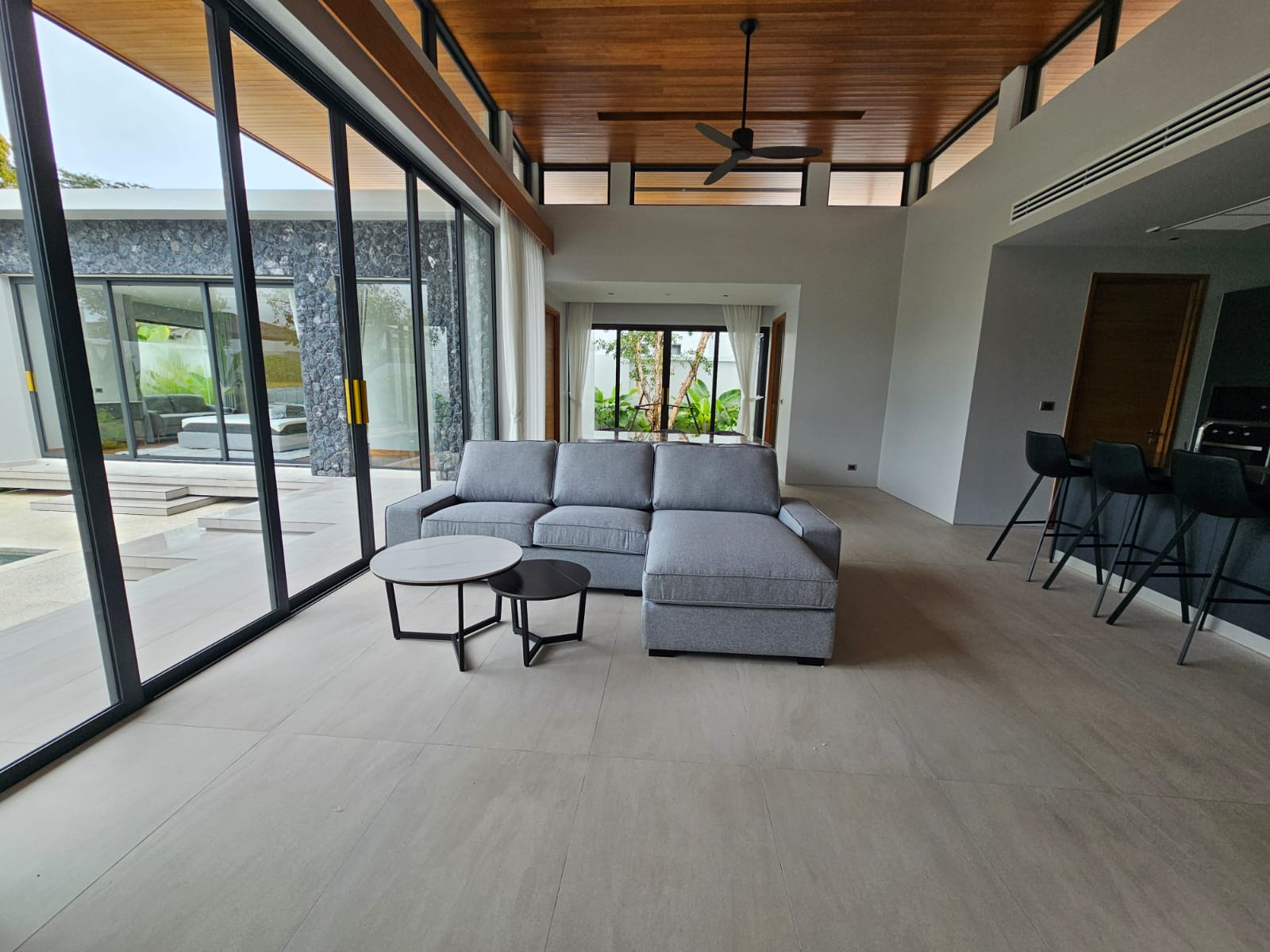 Villa Luma Botanica fully equipped modern kitchen with central island and bar stools