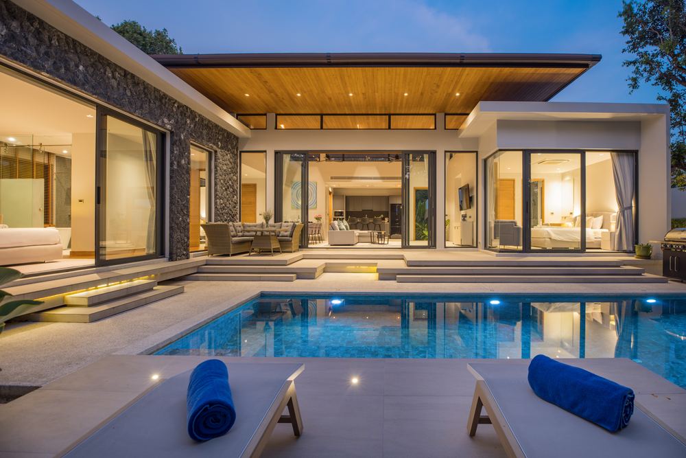 Villa Luma Botanica, pool terrace at dusk, Bang Tao Phuket