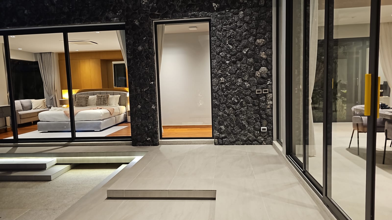 Villa Luma Botanica private swimming pool with wooden sun loungers and tropical landscaping